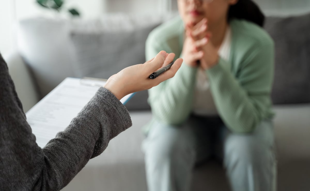 Psychologist listening to a patient during a therapy session
